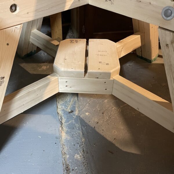 Close up of the pub style picnic table's centre footrest